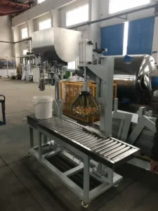 Precision filling machine for packaging finished rotogravure inks into containers with weight verification.